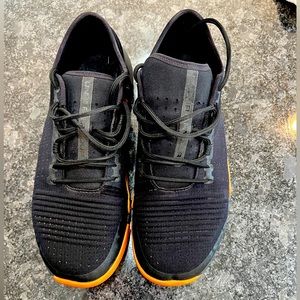 Black and tan Under Armour training shoes. Hardly worn, 11 1/2.